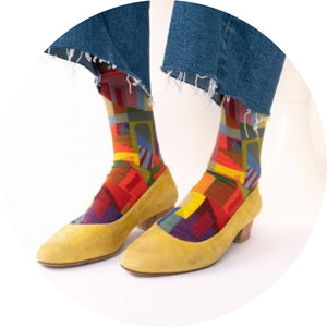 frayed jeans with multi coloured Bonne Maison socks in yellow socks